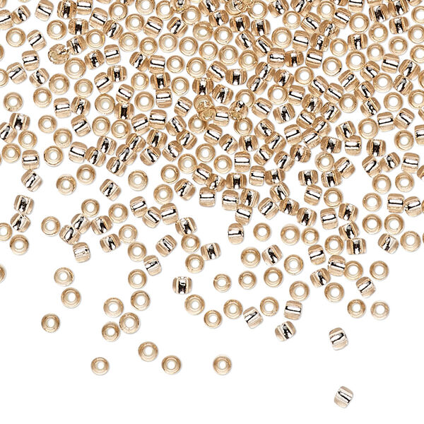 Seed bead, TOHO BEADS®, glass, pkg/7.5g, #11 round, transparent silver-lined rosaline (TR-11-31). image number 0