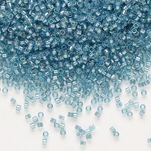 Seed bead, Delica®, glass, pkg/7.5g, #11 round, translucent dusk-lined luster crystal clear (DB-2383).