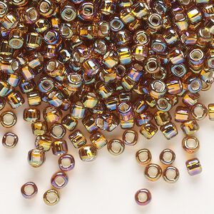 Seed bead, Dyna-Mites™, glass, silver-lined translucent rainbow root beer, #6 round with square hole. Sold per 40-gram pkg.