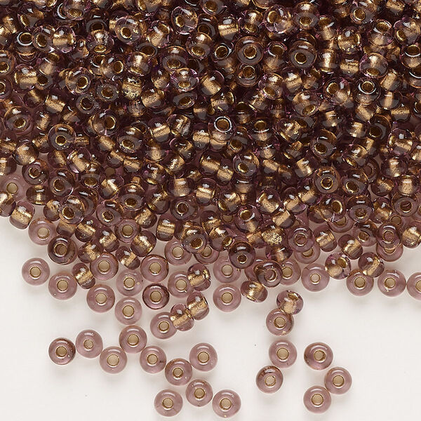 Seed bead, glass, pkg/50g, #8 rocaille, transparent color-lined bronze light amethyst. image number 0