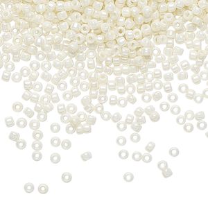 Seed bead, TOHO BEADS®, glass, pkg/250g, #11 round, opaque luster Navajo white (TR-11-122).