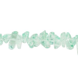Bead, glass, translucent mint green, small to extra-large chip. Sold per 30-inch strand.
