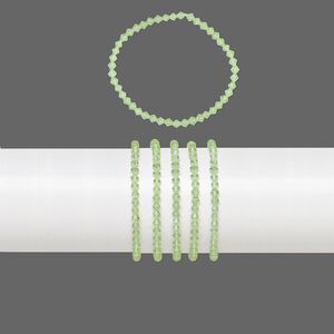 Bracelets, stretch, glass, transparent lime green, 4mm faceted bicone, 7 inches. Sold per pkg of 5.