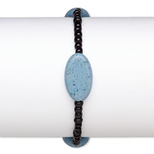 Bracelet, stretch, glass, opaque black and blue, 4x3mm-5x4mm rondelle and 23x13mm-23x14mm puffed oval, 7 inches. Sold individually.