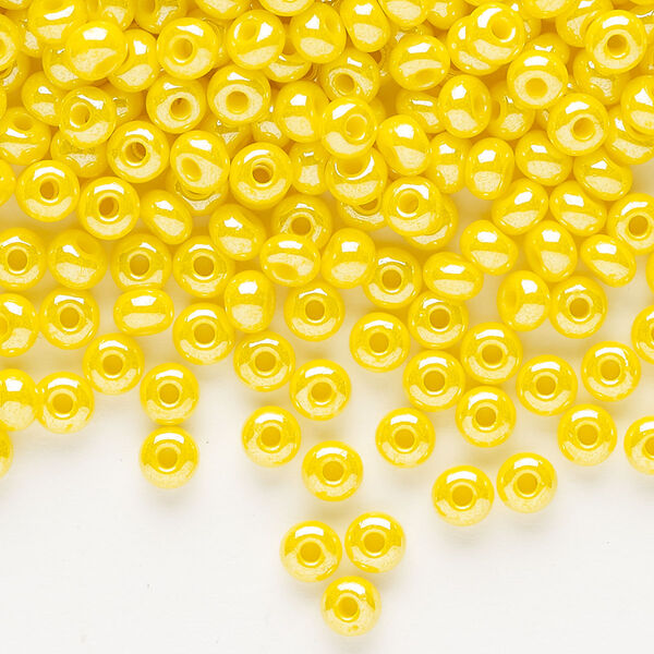 Seed bead, Preciosa Ornela, glass, opaque luster yellow, #6 rocaille. Sold per 500-gram pkg. image number 0