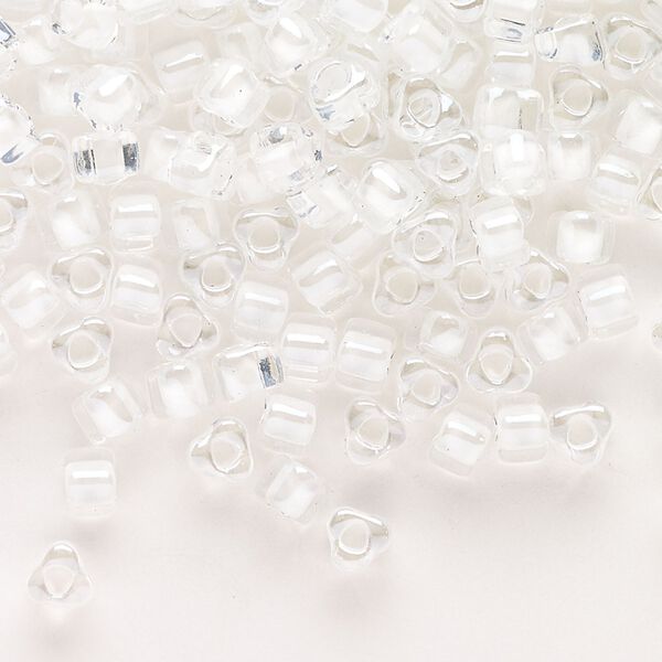 Seed bead, Miyuki, glass, transparent clear color-lined white, (TR1104), #5 triangle. Sold per 250-gram pkg. image number 0