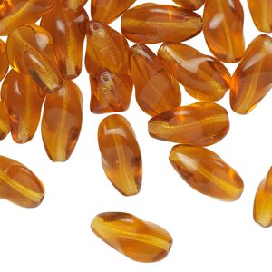 Bead, pressed glass, translucent golden honey, 14x9mm twisted freeform. Sold per 1-ounce pkg, approximately 35 beads.