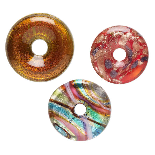 Random focal mix, lampworked glass, pkg/3, opaque mixed colors with silver-colored foil and copper-colored glitter, 29-36mm undrilled donut. image number 0