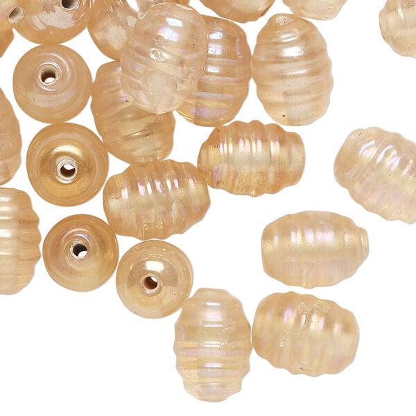 Bead, lampworked glass, translucent light peach luster, 11x9mm-13x9mm ribbed oval. Sold per pkg of 50. image number 0