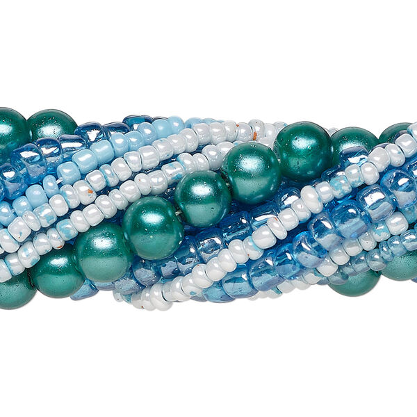 Bead assortment, glass, opaque to transparent light to dark aqua blue, 3x1mm-6mm round and irregular rondelle. Sold per pkg of (8) 14-inch strands, approximately 1,200 beads. image number 0