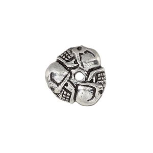Bead, antique silver-plated white brass, 17x8mm triangle rondelle with skulls, 2mm hole. Sold individually.