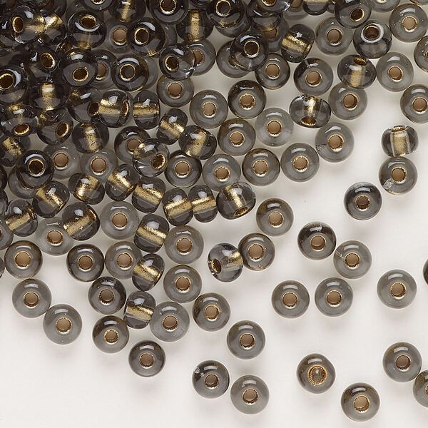 Seed bead, glass, pkg/50g, #6 rocaille, translucent color-lined bronze smoky quartz. image number 0
