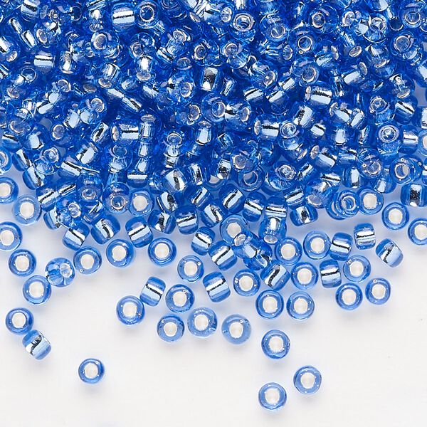Seed bead, Dyna-Mites™, glass, silver-lined translucent blue, #8 round. Sold per 1/2 kilogram pkg. image number 0