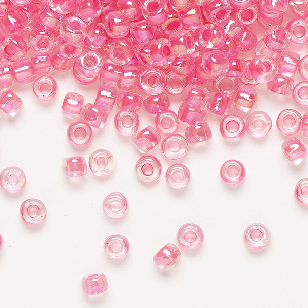 Seed bead, Dyna-Mites™, glass, transparent rainbow inside color hot pink, #6 round. Sold per 1/2 kilogram pkg. image number 0