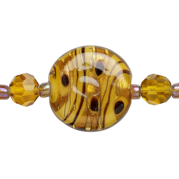 Bead, glass and lampworked glass, topaz yellow and black, 7mm faceted round / 9mm round / 21mm flat round with copper-colored glitter. Sold per 7-inch strand, approximately 25 beads. image number 0