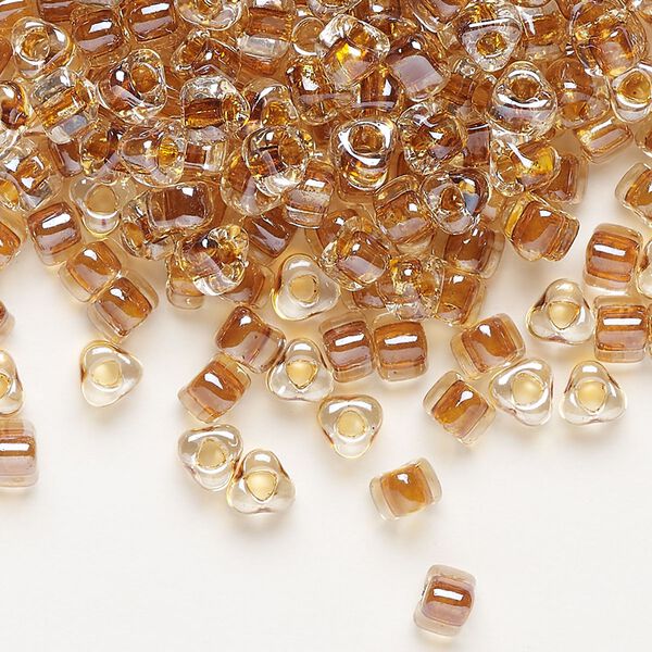 Seed bead, Miyuki, glass, transparent clear color-lined amber yellow, (TR1108), #5 triangle. Sold per 25-gram pkg. image number 0