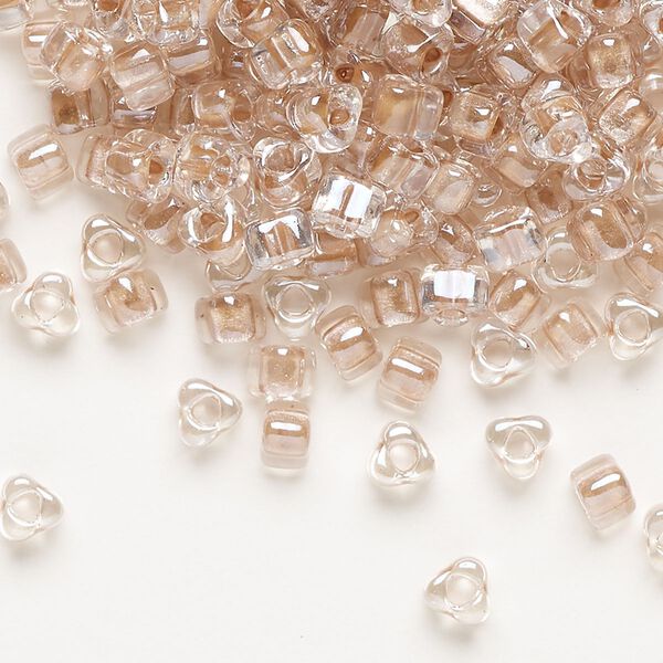 Seed bead, Miyuki, glass, transparent clear color-lined copper, (TR1129), #5 triangle. Sold per 25-gram pkg. image number 0