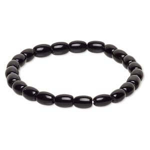 Bracelet, stretch, glass, black, 7x5mm-8x6mm barrel, 6-1/2 inches. Sold individually.
