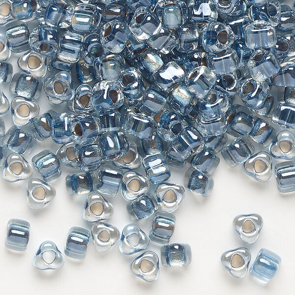 Seed bead, Miyuki, glass, transparent clear color-lined dark blue, (TR1115), #5 triangle. Sold per 250-gram pkg. image number 0