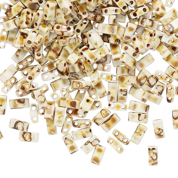 Seed bead, TILA®, glass, pkg/250g, 5x2.3mm half tila rectangle, opaque Picasso antique white, (HTL-4512). image number 0