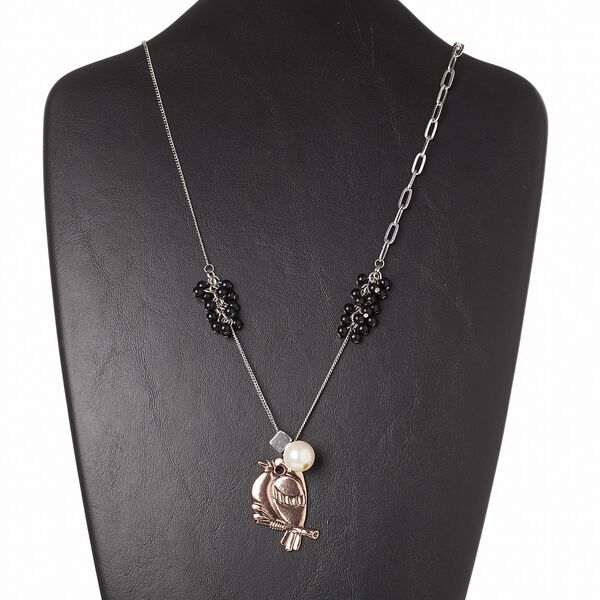 Necklace, acrylic / Czech glass rhinestone / antiqued copper-finished "pewter" (zinc-based alloy) / antiqued silver-finished brass and steel, white and black, 40x30mm bird, 34 inches with 3-inch extender chain and lobster claw clasp. Sold individually. image number 0
