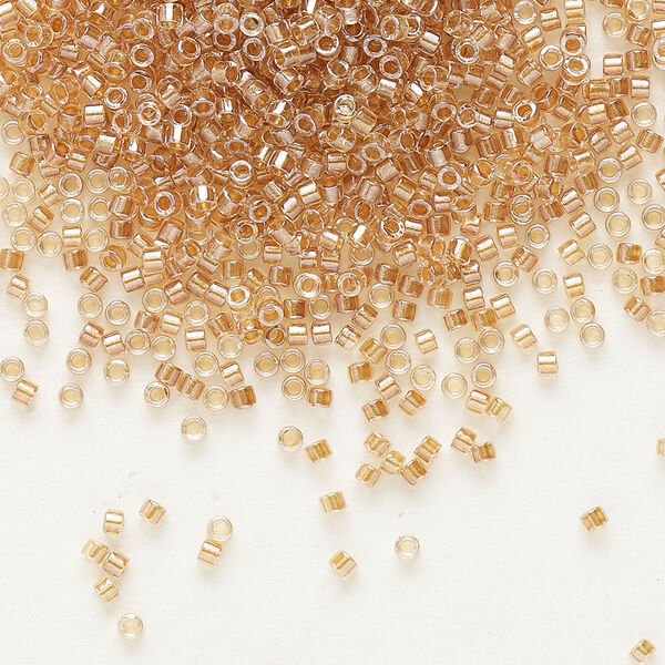 Seed bead, Delica®, glass, pkg/7.5g, #11 round, translucent honey beige-lined luster crystal clear (DB-0901). image number 0