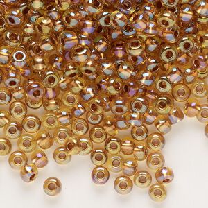 Seed bead, glass, pkg/50g, #6 rocaille, translucent color-lined copper iris beige.