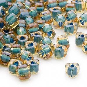 Seed bead, Miyuki, glass, transparent amber yellow color-lined teal, (TR1169), #5 triangle. Sold per 250-gram pkg.