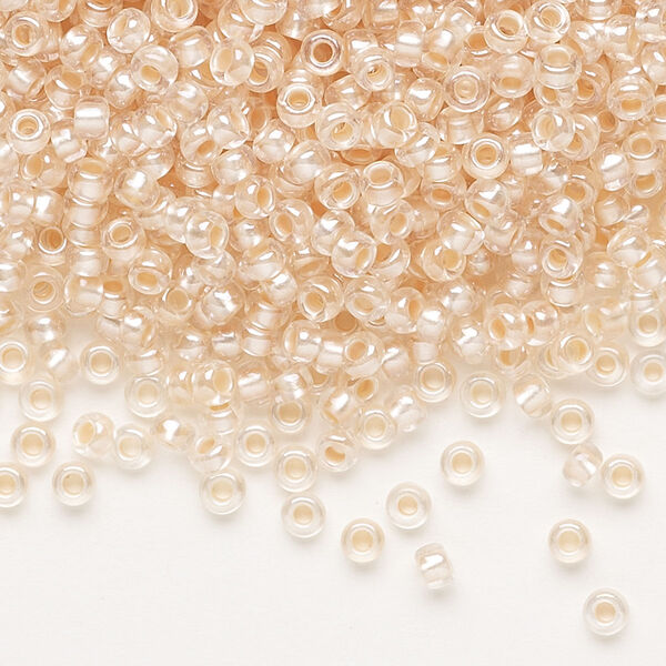 Seed bead, Preciosa Ornela, glass, translucent salmon pearl-lined crystal clear, #8 rocaille. Sold per 500-gram pkg. image number 0