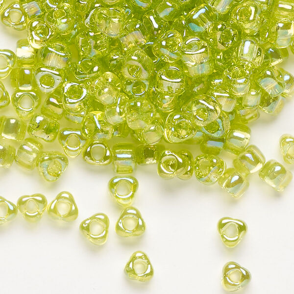 Seed bead, Miyuki, glass, transparent iris lime, (TR1153), #5 triangle. Sold per 250-gram pkg. image number 0