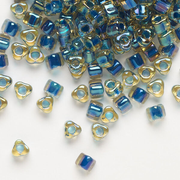 Seed bead, Miyuki, glass, transparent amber yellow color-lined dark blue, (TR1826), #5 triangle. Sold per 25-gram pkg. image number 0