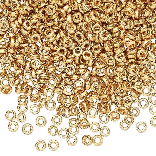 Seed bead, Miyuki, glass, pkg/10g, 3x1.3mm spacer rondelle, opaque gold finish, (SPR3-4202). image number 0