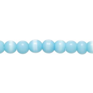 Bead, cat's eye glass (fiber optic glass), sky blue, 5-7mm irregular round. Sold per 14-inch strand, approximately 70 beads.