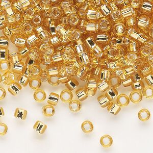 Seed bead, Dyna-Mites™, glass, silver-lined translucent medium gold, #6 round with square hole. Sold per 1/2 kilogram pkg.