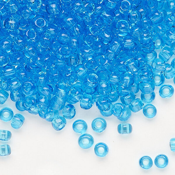 Seed bead, Dyna-Mites™, glass, transparent light turquoise blue, #6 round. Sold per 1/2 kilogram pkg. image number 0