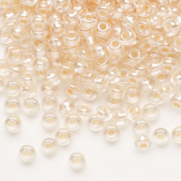 Seed bead, Preciosa Ornela, glass, translucent salmon pearl-lined crystal clear, #6 rocaille. Sold per 500-gram pkg. image number 0