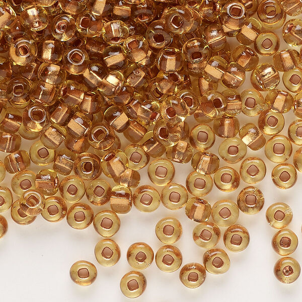 Seed bead, glass, pkg/50g, #6 rocaille, translucent color-lined copper topaz. image number 0