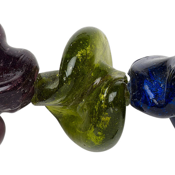 Bead, lampworked glass, transparent mixed colors with silver-colored foil, 30x24mm-38x36mm twist with 2-6mm hole. Sold per 15-inch strand. image number 0