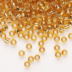 Seed bead, Dyna-Mites™, glass, transparent silver-lined gold, #6 round. Sold per 1/2 kilogram pkg.