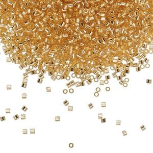 Seed bead, Delica®, glass, pkg/250g, #15 round, transparent silver-lined gold (DBS-0042).