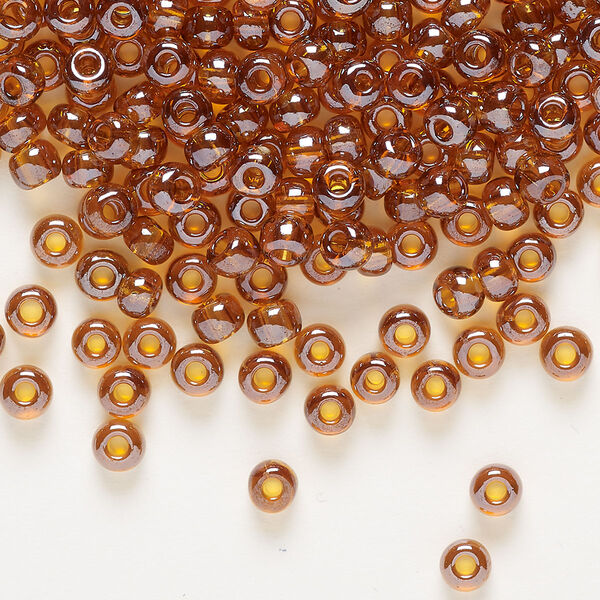 Seed bead, Preciosa Ornela Czech glass, pkg/500g, #6 rocaille, translucent luster topaz, (16090). image number 0
