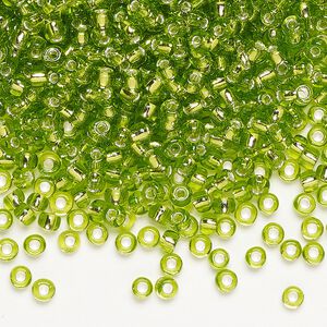 Seed bead, Dyna-Mites™, glass, silver-lined translucent light green, #8 round. Sold per 1/2 kilogram pkg.