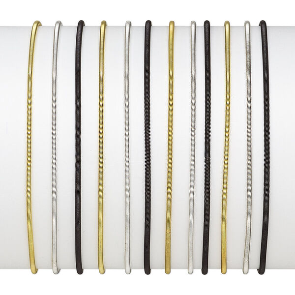 Bracelet, stretch, steel / gold- / silver-finished steel, black, 2mm wide, 7-1/2 inches. Sold per pkg of 12. image number 0