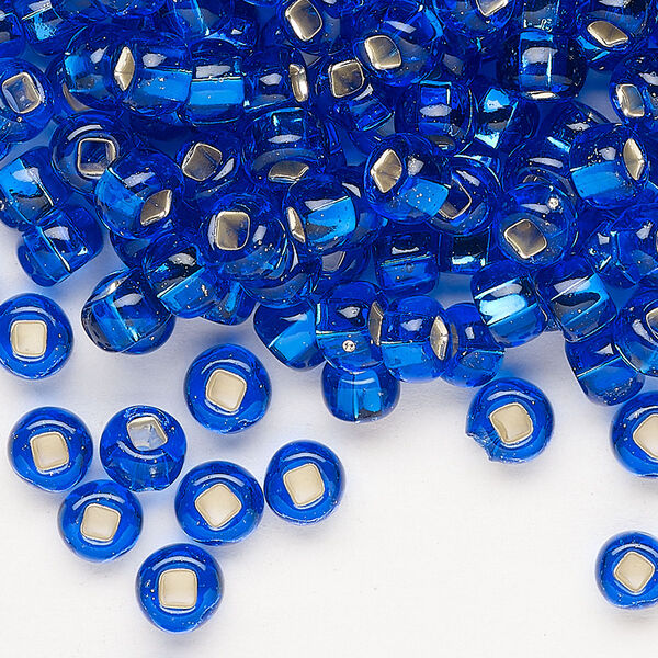 Seed bead, Preciosa Ornela, glass, transparent silver-lined sapphire blue, #2 rocaille with square hole. Sold per 500-gram pkg. image number 0