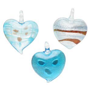 Random focal mix, lampworked glass, translucent blue, 34x30mm-40x37mm domed heart with copper-colored glitter and silver-colored foil. Sold per pkg of 3.