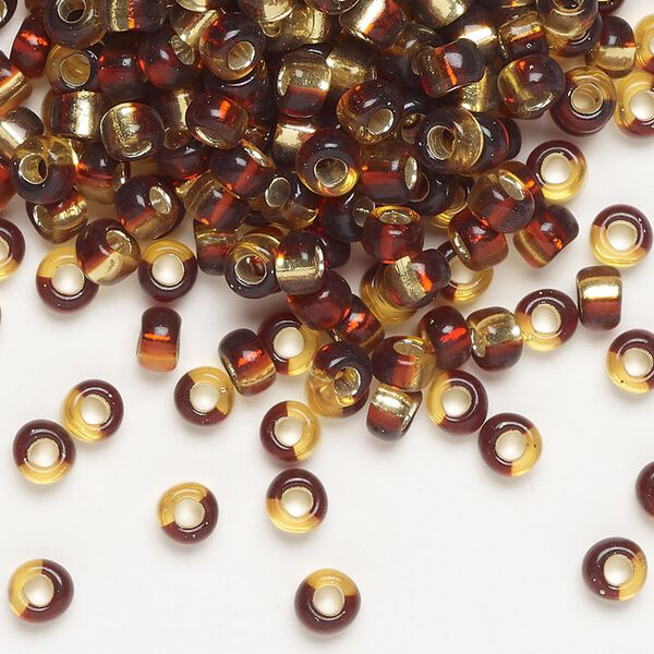 Seed bead, Miyuki, glass, pkg/25g, 4mm irregular round, transparent silver-lined dark red/gold, (TB-3936). image number 0