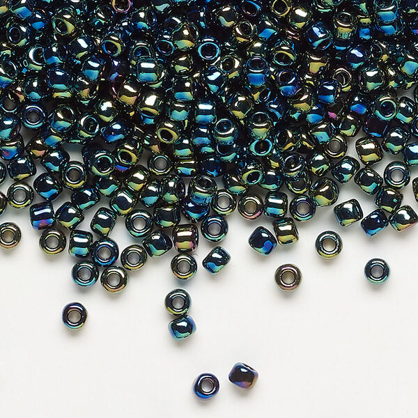 Seed bead, Dyna-Mites™, glass, transparent rainbow multi-iris, #8 round. Sold per 40-gram pkg. image number 0