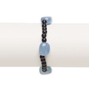 Bracelet, stretch, quartz (dyed) and acrylic, black and blue, 5mm round and small to medium tumbled nugget, 7 inches. Sold individually.