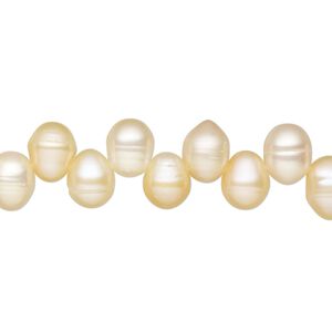 Pearl, cultured freshwater, peach, 9x7mm-10x7mm top-drilled rice, C grade. Sold per 15-inch strand.
