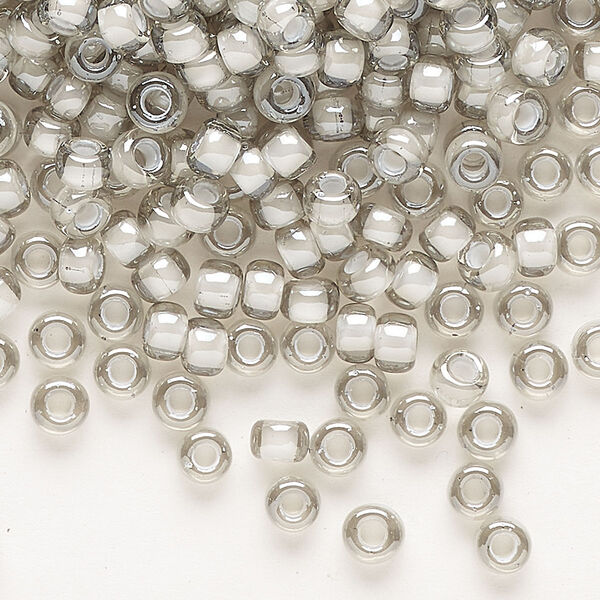 Seed bead, Miyuki, glass, pkg/250g, #6 rocaille, translucent moonstone-lined luster crystal clear (RR-2268). image number 0